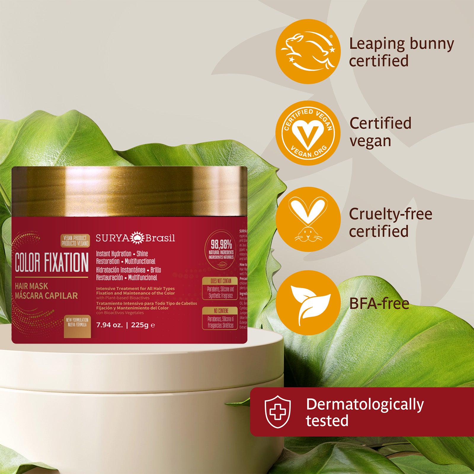 A product on a stack: NEW Color Fixation Restorative Hair Mask Surya Brasil 7.94oz. Red and gold container with white container and red label. Logo of a plant, rabbit, and close-ups.