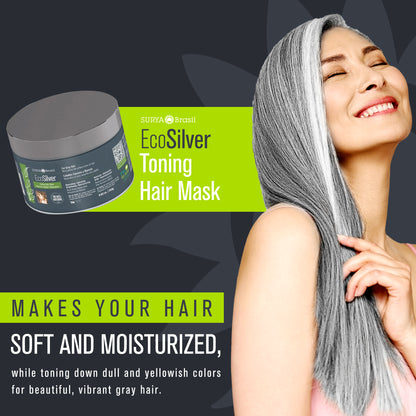 A woman with long grey hair smiling, holding EcoSilver Toning Hair Mask, a hair care product to neutralize yellow tones, nourish, and restore hair shine and resilience.